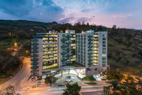 an aerial view of a building at night at Hotel Spirito by Spiwak Chipichape in Cali
