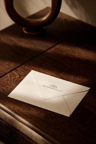 a white envelope sitting on top of a wooden table at Telegraphenamt in Berlin
