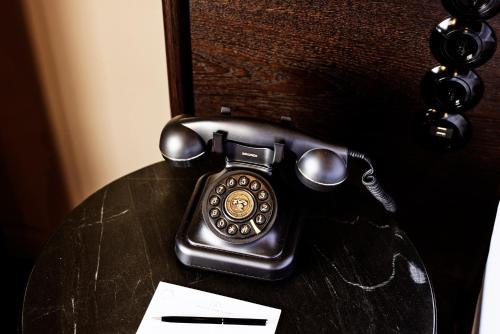 a phone sitting on top of a table at Telegraphenamt in Berlin