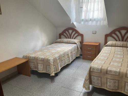Posteľ alebo postele v izbe v ubytovaní Apartamento Telefónica Trece