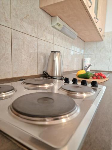 a stove top with four burners on it in a kitchen at Apartment Iva in Trogir