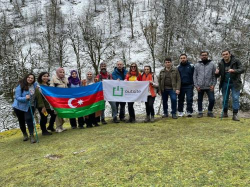a group of people posing for a picture with a flag at Sim Guesthouse in Sım