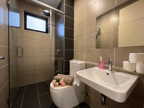 a bathroom with a sink and a toilet at D'pristine by Antlerzone in Johor Bahru