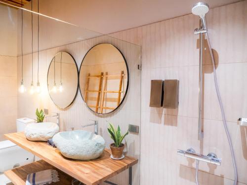 a bathroom with a sink and a mirror at ARjAU Boutique Hotel - Adults Only in Santa Teresa Beach