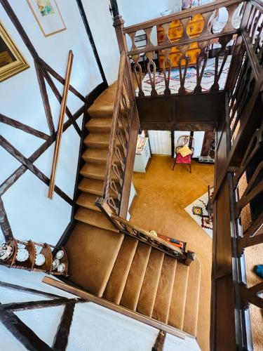 an overhead view of a spiral staircase in a house at Pentre Cerrig Country House in Llanferres