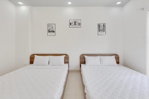 Postel nebo postele na pokoji v ubytování Saigon Authentic Hostel - Local Vibes, Food Tours, City Walks, Cooking Classes, Free Breakfast, Gym & Rooftop