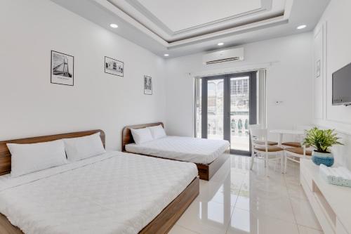 Postel nebo postele na pokoji v ubytování Saigon Authentic Hostel - Local Vibes, Food Tours, City Walks, Cooking Classes, Free Breakfast, Gym & Rooftop