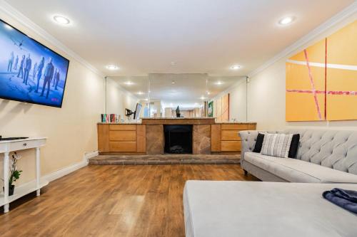 a living room with a couch and a fireplace at Spacious 5-Bedroom Retreat with Pool Minutes from the Las Vegas Strip in Las Vegas