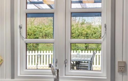 a view of a table through a window at 3 Bedroom Cozy Home In Nykøbing Sj in Lumsås