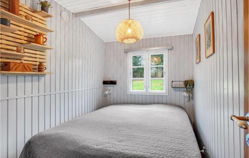 a bedroom with a bed and a window at 3 Bedroom Cozy Home In Nykøbing Sj in Lumsås