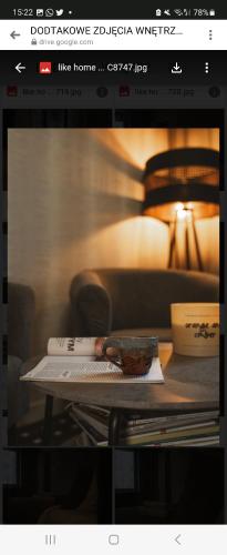 a page of a website with a table with a book at LIKE HOME 2 Sauna,Jacuzzi & Spa in Świdnica