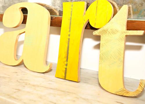a wooden sign that says love on a table at Arthouse Canterbury-Free Secure Parking in Canterbury
