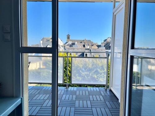 a view from an open door of a balcony at Plage, piscine, terrasse & centre-ville à Quiberon in Quiberon