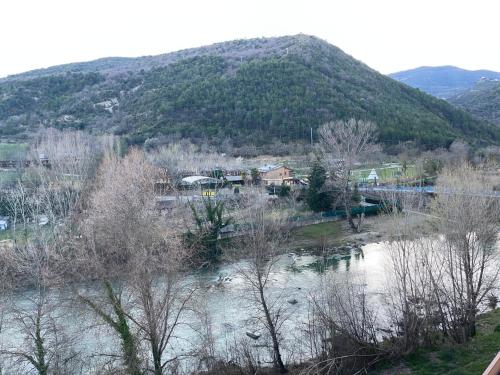 a view of a river with a mountain in the background at APARTAMENTOS RioMonte 5 - DeLuxe con Jacuzzi in Boltaña