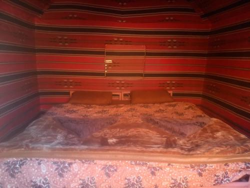 Ένα ή περισσότερα κρεβάτια σε δωμάτιο στο Wadi rum secrets camp