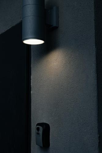 a light hanging on a wall with a switch at Diamond Mansion-Suite B in Had Nes