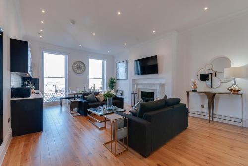 a living room with a couch and a table at 80 by Elite in Liverpool