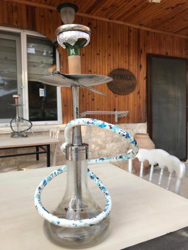 a lamp on a table with a rope around it at OzenTurku Hotel in Pamukkale