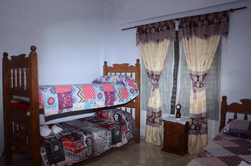 Dviaukštė lova arba lovos apgyvendinimo įstaigoje Apartamentos Naomi