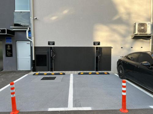 a car parked in front of a garage at DMS Apartments & Suites Sarajevo in Vogošća