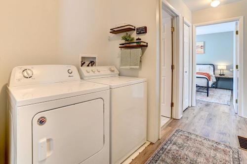 a white washer and dryer in a laundry room at Roscommon Retreat with Deck about 1 Mile to Higgins Lake in Roscommon