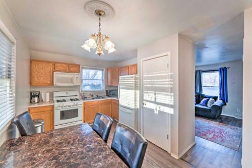 a kitchen with a table and chairs and a dining room at Family-Friendly Rockford Home with Private Yard! in Rockford