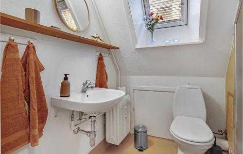 a bathroom with a toilet and a sink at Beautiful Apartment In Aabenraa With Wifi And 2 Bedrooms in Aabenraa