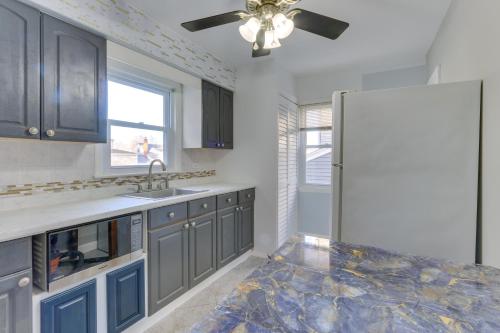 a kitchen with a sink and a refrigerator at about 20 Mi to Manhattan Quaint Clifton Home! in Clifton