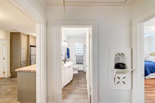 a white bathroom with a sink and a toilet at Waco Vacation Rental about 2 Mi to Magnolia Market! in Waco