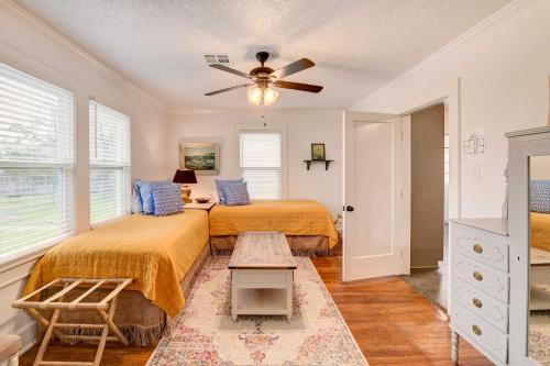 a bedroom with two beds and a ceiling fan at Vacation Rental about 2 Mi to Magnolia Market! in Waco