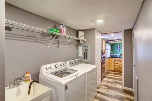 a laundry room with a washer and dryer at Port Clinton House with Boat Dock on Portage River! in Port Clinton
