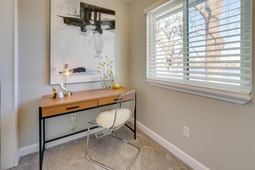 a desk with a chair in a room with a window at Lakefront Home Rental with Hot Tub in White Lake! in Oxbow