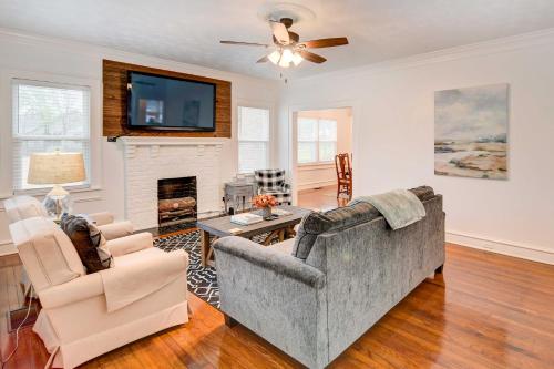 a living room with a couch and a fireplace at 2 Mi to Dtwn Waco Home with Shared Yard! in Waco