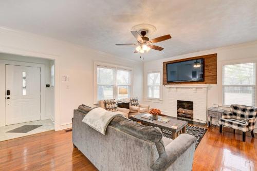 a living room with a couch and a fireplace at 2 Mi to Dtwn Waco Home with Shared Yard! in Waco