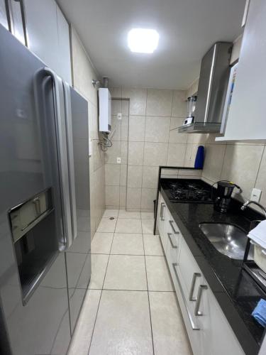 Η κουζίνα ή μικρή κουζίνα στο Apartamento condomínio Bech Village Fortaleza