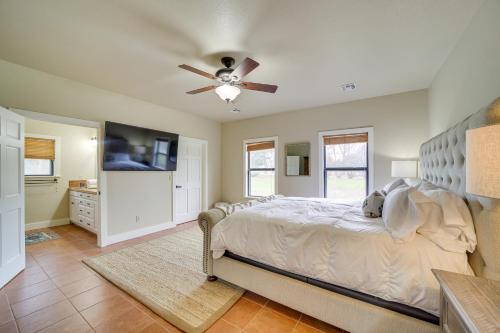 a bedroom with a bed and a ceiling fan at Lakefront Eufaula Vacation Rental with Private Dock in Eufaula