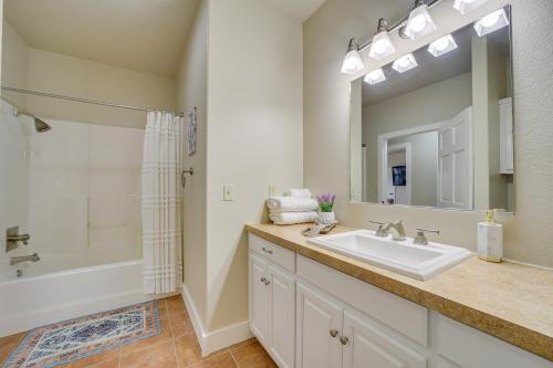 a bathroom with a sink and a shower and a mirror at Lakefront Eufaula Vacation Rental with Private Dock in Eufaula