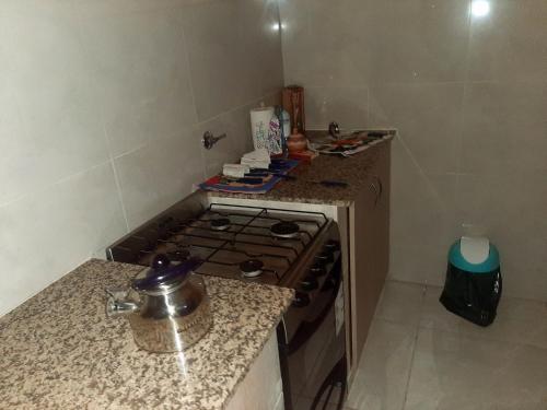 a kitchen with a stove and a counter top at Apartamentos El Mirador 3 C in El Carmen