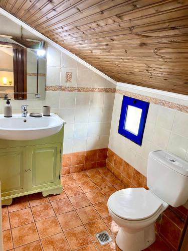 a bathroom with a toilet and a sink at Fourka House in Kassandra