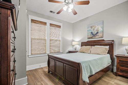 a bedroom with a bed and a ceiling fan at Cinzia Lane Bungalow in Myrtle Beach