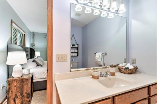 a bathroom with a sink and a mirror at Pet-Friendly Mosinee Retreat w/ Private Dock! in Mosinee