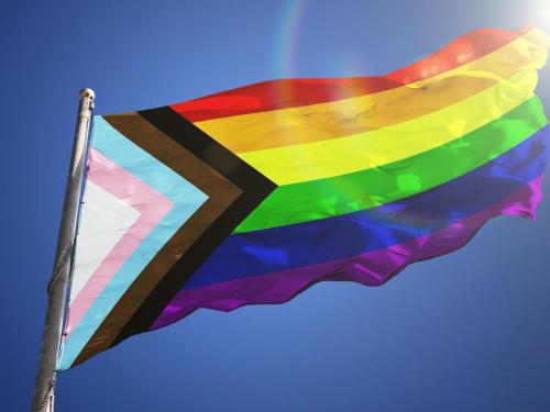 a rainbow flag flying in the sky at LOTE4 - LGBTQ Studios in Playa del Carmen