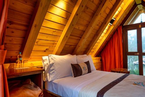 Postel nebo postele na pokoji v ubytování Hacienda Turistica Intihuatana