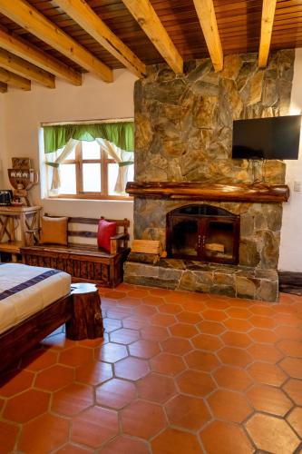 Postel nebo postele na pokoji v ubytování Hacienda Turistica Intihuatana