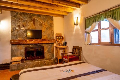 Postel nebo postele na pokoji v ubytování Hacienda Turistica Intihuatana