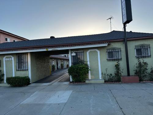 an empty building with an alleyway in front of it at Vegas motel in West Athens