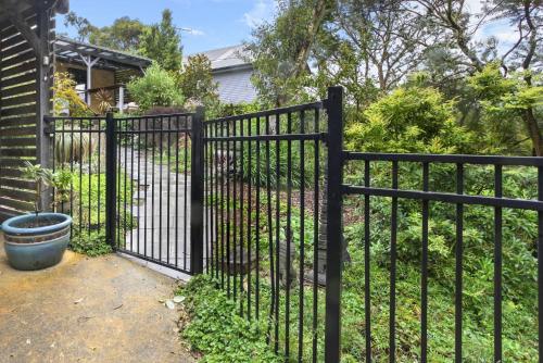 a black metal fence in front of a yard at Blackheath Suite (2 b/rooms) Family/Pet Friendly in Blackheath