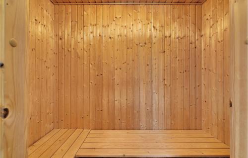 a wooden sauna with a wooden floor at Cozy Home In Brenderup Fyn With Wifi in Bro