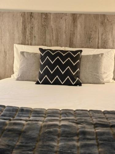 a bed with pillows on it with at Vale Da Misarela in Geres