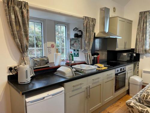 a kitchen with a sink and a counter top at Talla Hope in Portree